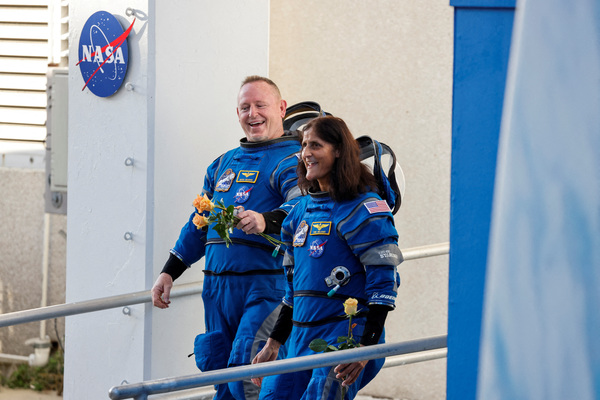 FILE PHOTO: NASA astronauts Butch Wilmore and Sunita Williams walk at NASA's Kennedy Space Center, ahead of Boeing's Starliner-1 Crew Flight Test (CFT) mission on a United Launch Alliance Atlas V rocket to the International Space Station, in Cape Canaveral, Florida, U.S., June 5, 2024. REUTERS/Joe Skipper/File Photo